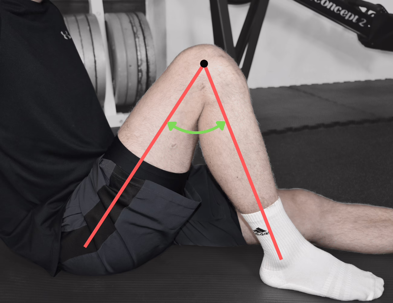 Athlet der sitzt und sein Beugedfizit Zeigt